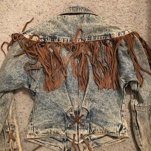 Vintage denim jacket with brown fringe.